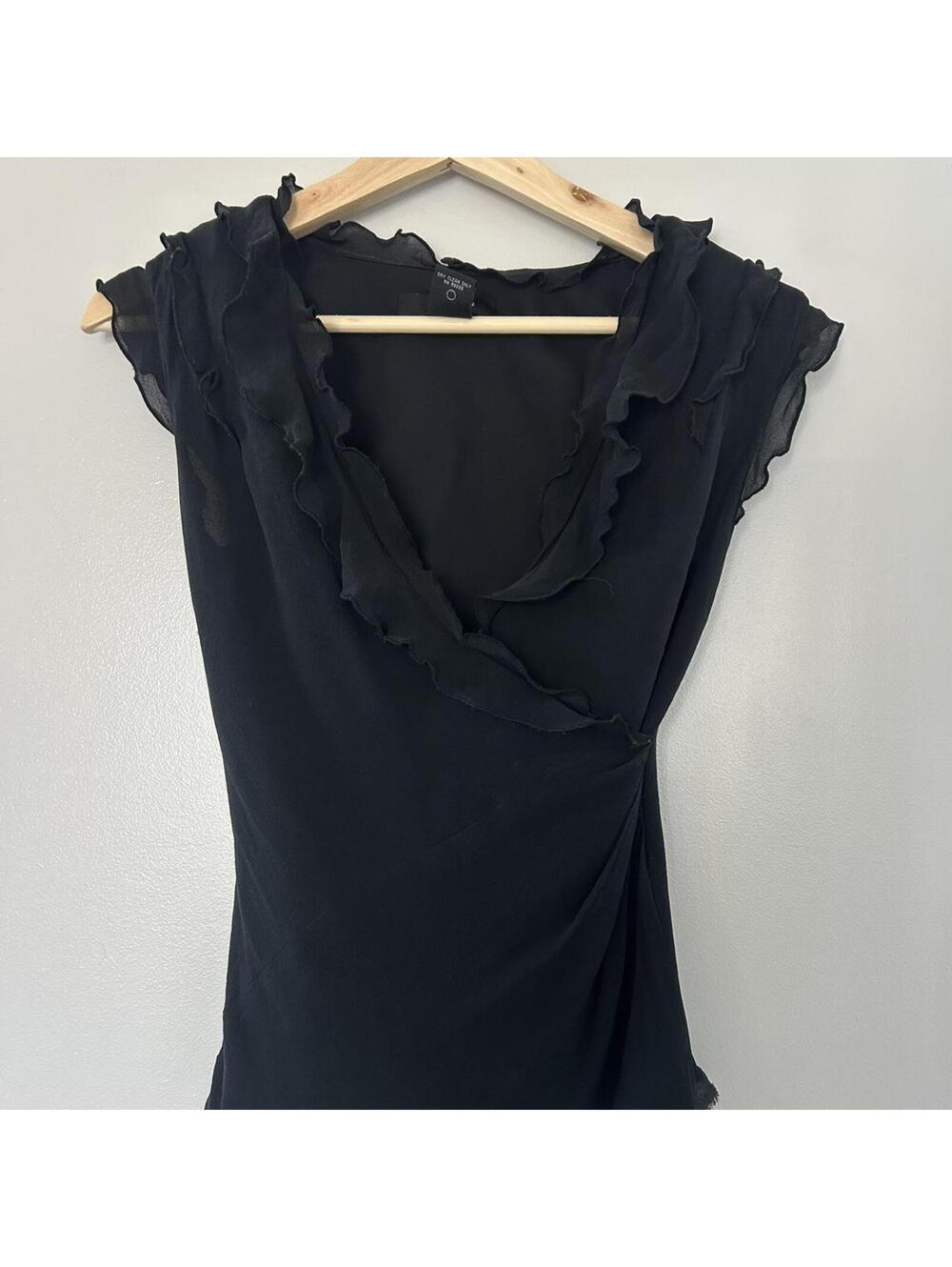Vintage Express black silk blouse with ruffle details.